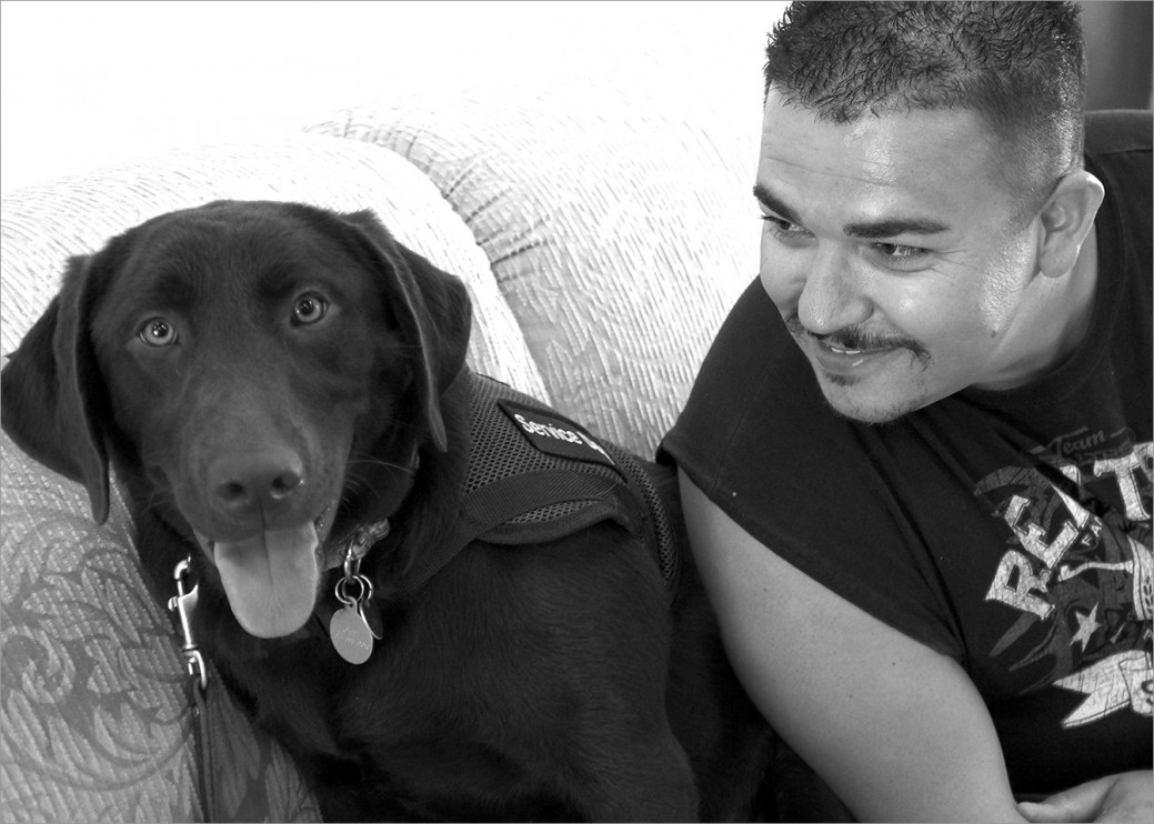 US Marine Corps veteran Felipe with his service dog Kachina in training at Operation Freedom Paws. 