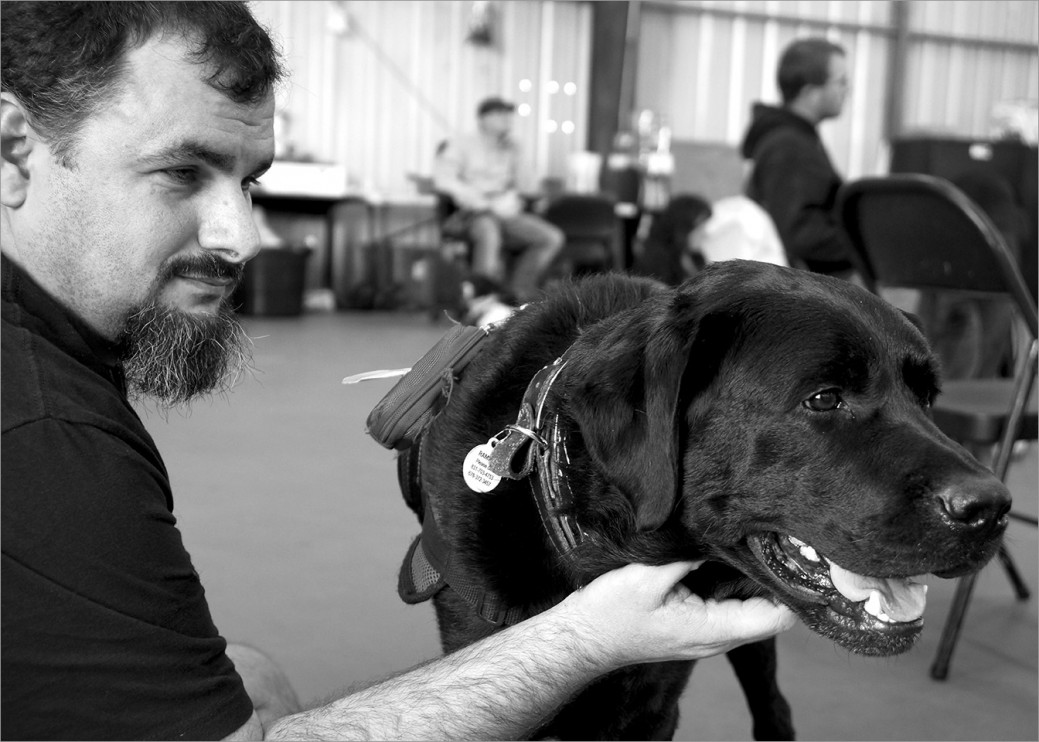 US Marine Corps veteran Chris Ramirez with his service dog Bobby. Chris served in Afghanistan during Operation Enduring Freedom. Like many veterans Chris believed that asking for help signaled weakness. He finally sought out the help of a service dog. Bobby eases the daily struggle with post-traumatic stress.