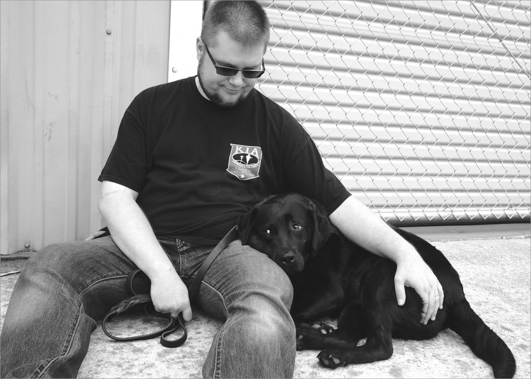 US Army veteran Bazyli with his service dog Kameza training at Operation Freedom Paws. Kameza is constantly by Bazyli’s side, alerting him to the onset of pain and reminding him to sit down and take break. 