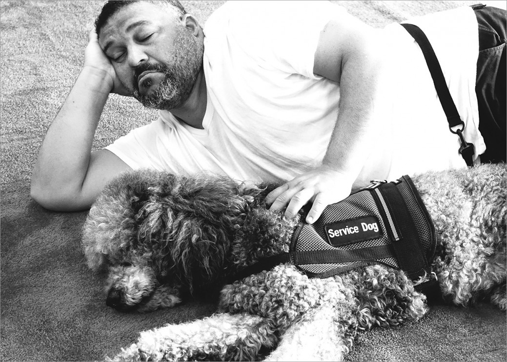 Suffering with post-traumatic stress, US Coast Guard Ray Abreu takes a pause during training with his service dog Sunny. “Things have changed since I met Sunny. You have no idea how much he has helped me turn around. I went from ‘closed Ray’ with my hat and shades to losing the shades. I was shedding my disguise.”