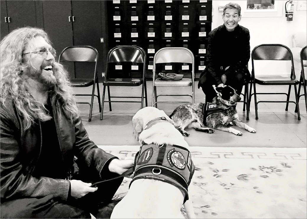 Veterans Jeff Wilson and Steve Loy with their service dogs having a good chuckle during class. The camaraderie between veterans is strong which helps with many issues, including trust. 