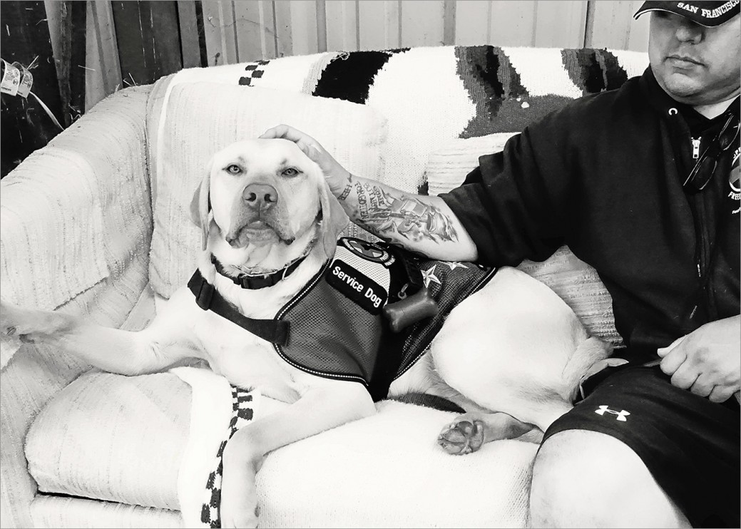 Veteran John and his service dog Fonzie take a quiet break from training class. Together they “walk the walk” and it’s clear their bond is strong, full of love and a lot of humor. 